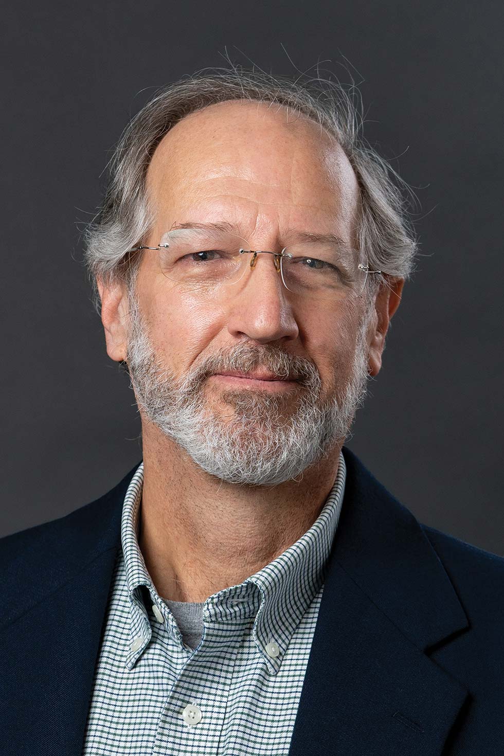 A headshot portrait photograph of Bob Keyes grinning (Editorial Director of Colby Magazine)