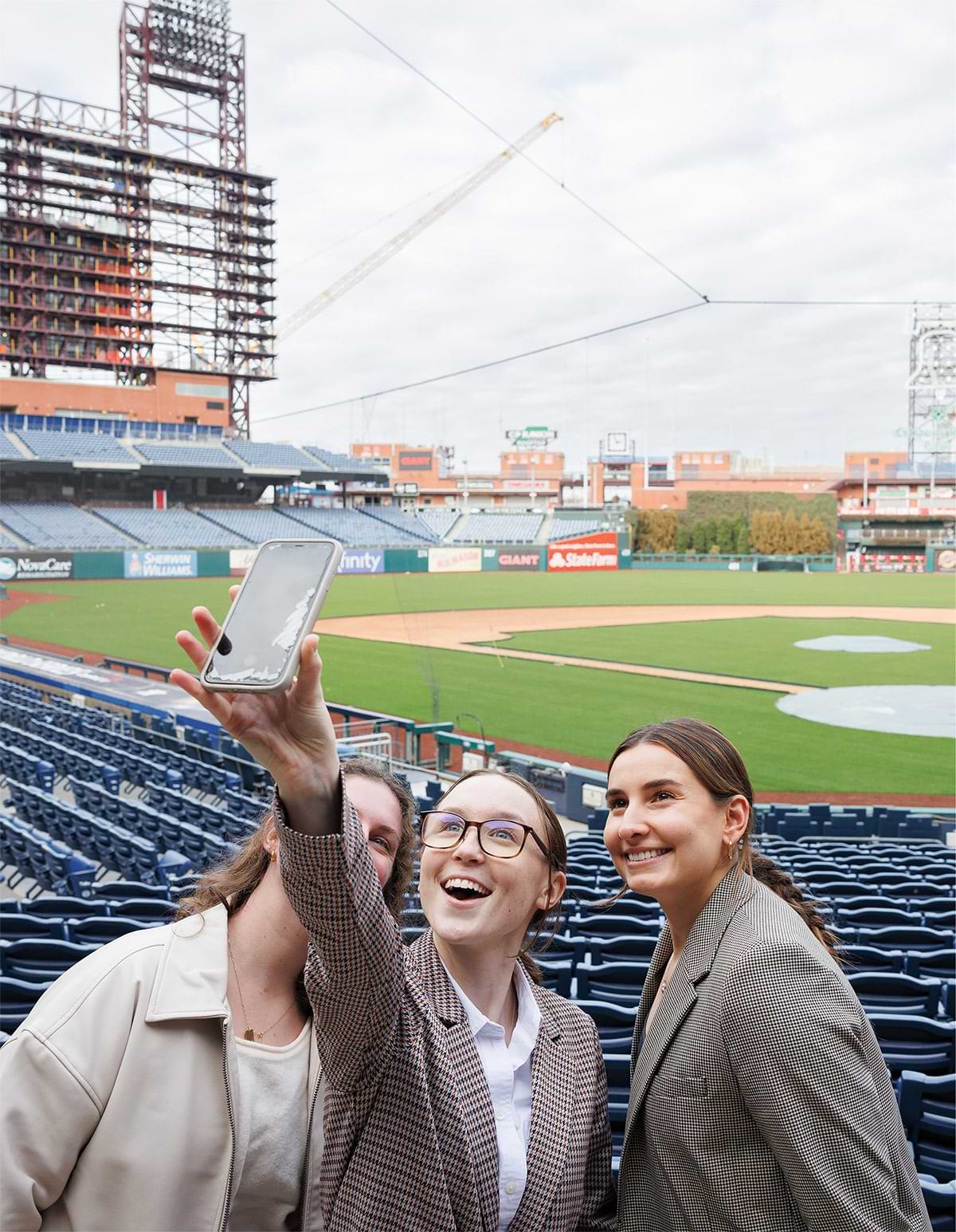 Kaitlyn Smith ’23 (from left), Sally Stokes ’26, and Caroline Bedrosian ’23 take a selfie at Citizens Bank Park in Philadelphia as part of a DavisConnects experience in January.