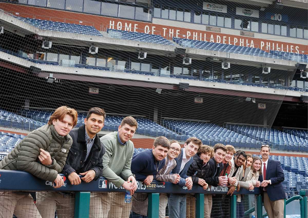 Students stand in a dugout at Citizens Bank Park in Philadelphia.