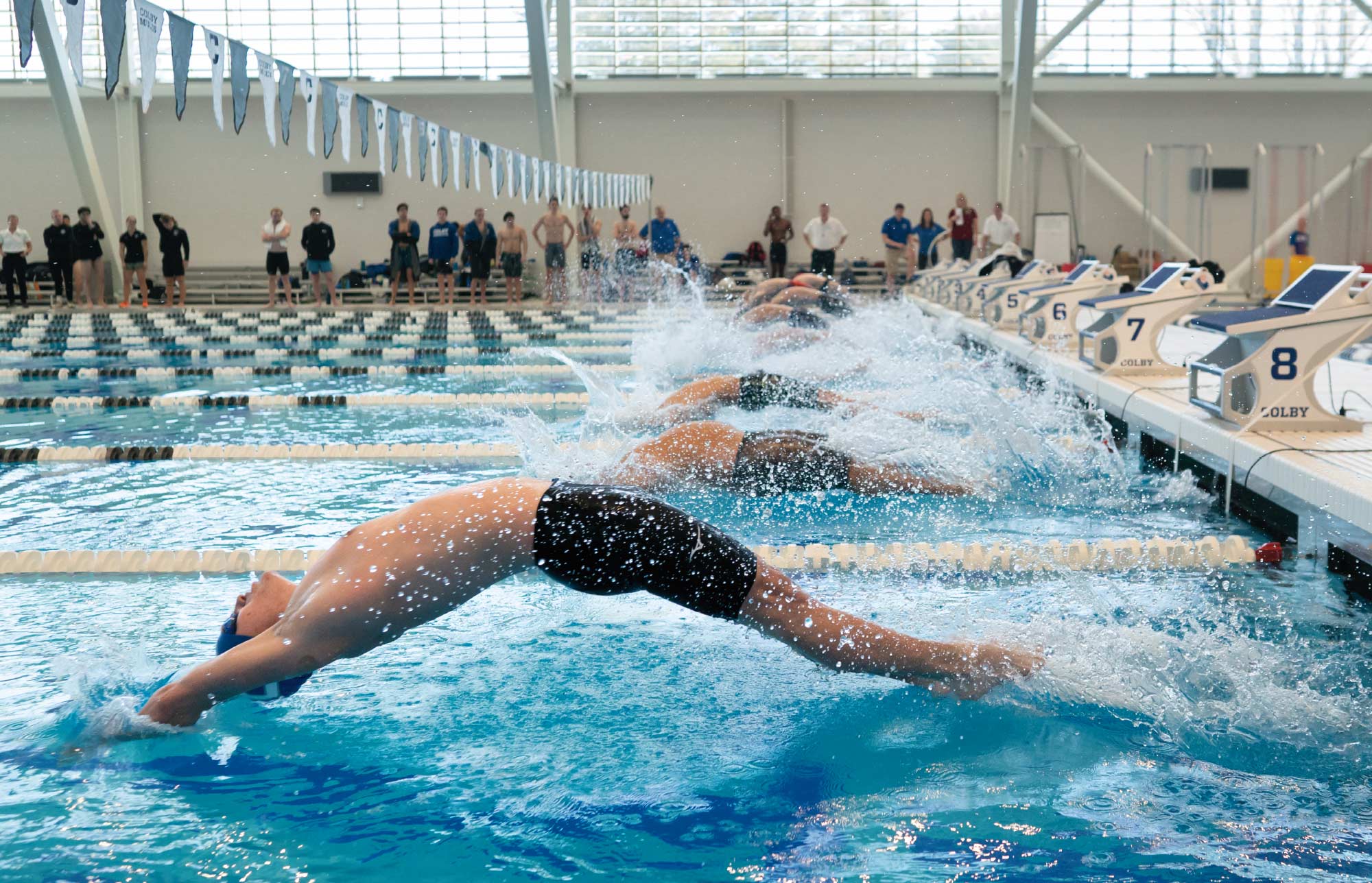 swimmers mid-race at the NESCAC Swimming and Diving Championships at its new Myrtha pool