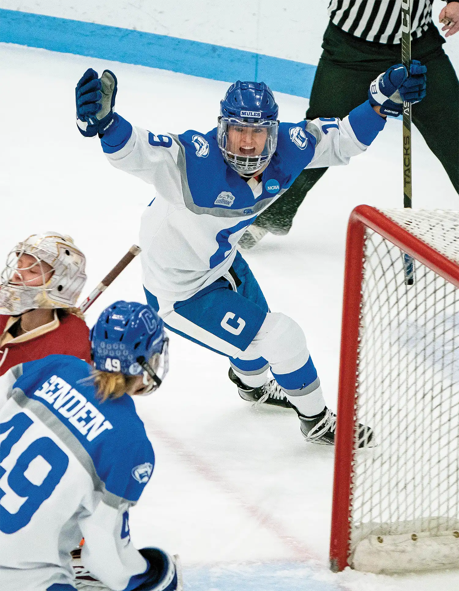 Colby College hockey player celebrating a goal