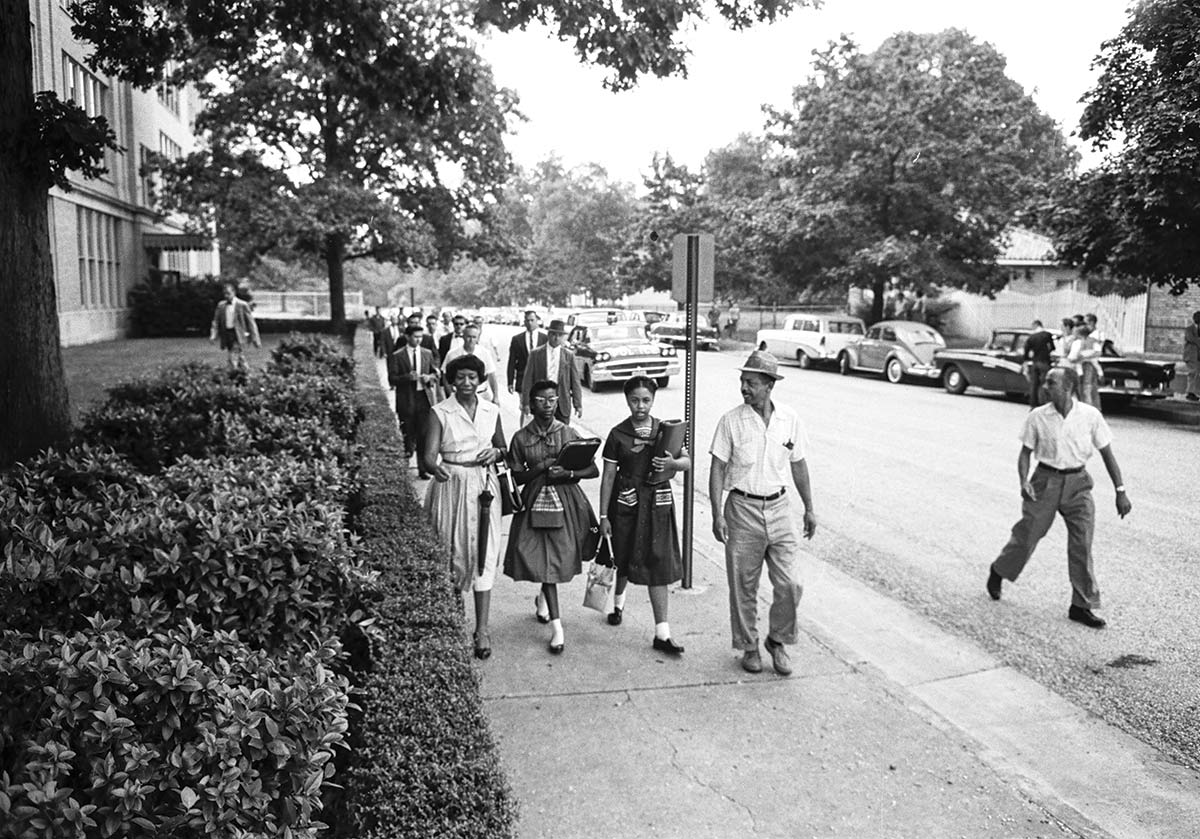 Carol Swann, right, and Gloria Mead are accompanied by Swann’s father and Mead’s mother on their walk to Chandler Junior High School on Sept. 6, 1960, the day they desegregated the school. (Courtesy Anderson Collection, The Valentine)