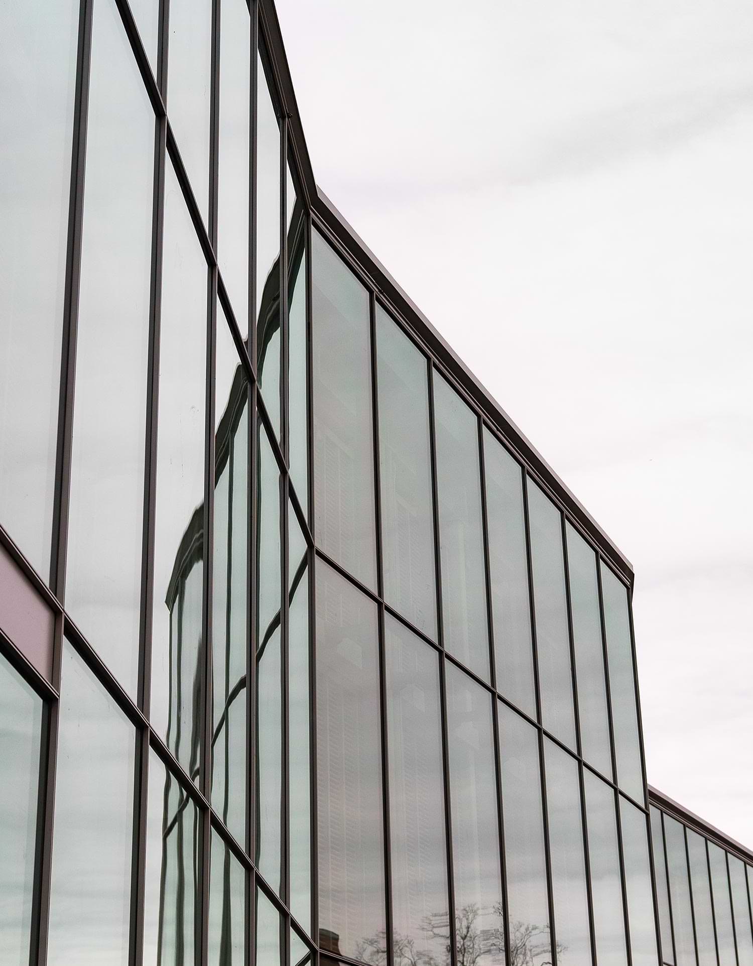 upward view of the a tall window filled façade on the Gordon Center for Creative and Performing Arts