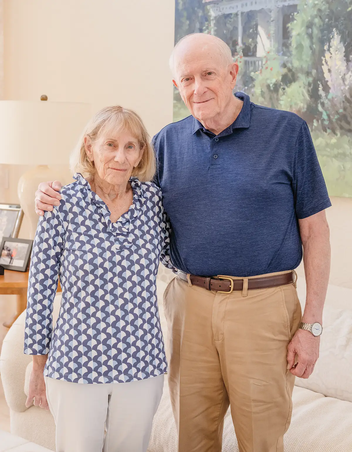 David Pulver and his wife, Carol, posing in a living room
