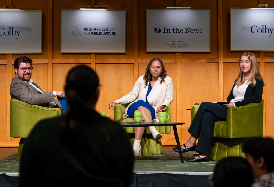 Panelists speak on stage at the Goldfarb Center for Public Affairs at Colby.